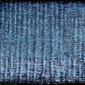 Indigo fabric sample with vertical ribbed texture and granular weave, displaying a dark label reading “egoitaliano > fabric (d) > marlys > 25”.